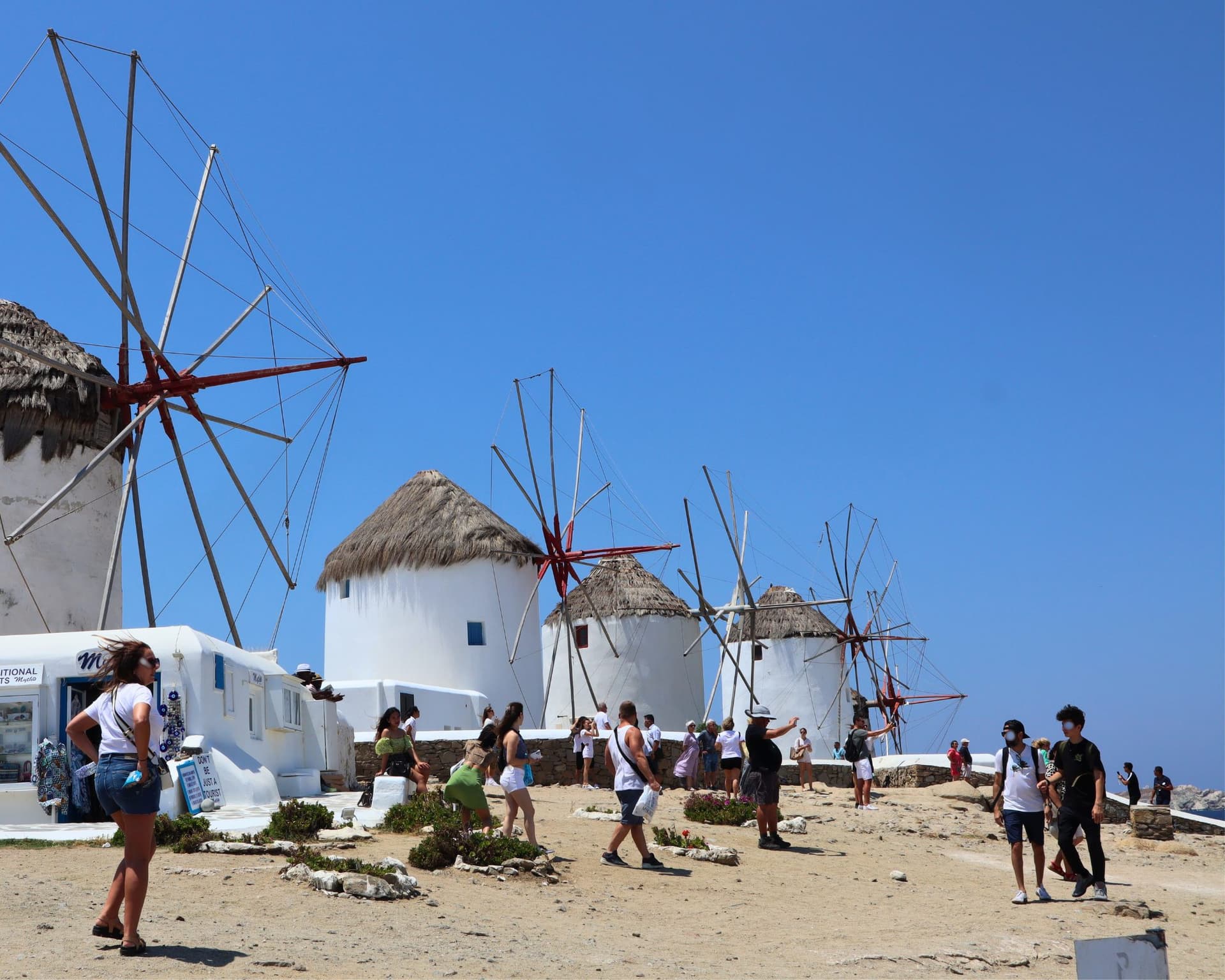 The windmills above Mykonos Town on a busy summer afternoon